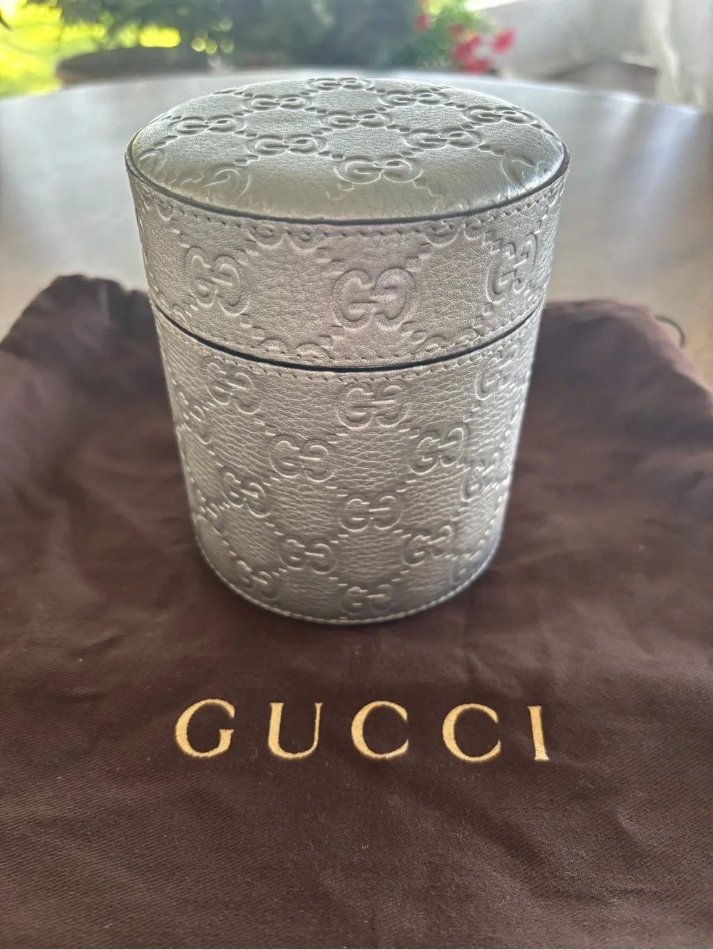 Gucci Candle Holder with lid and glass container with candle.